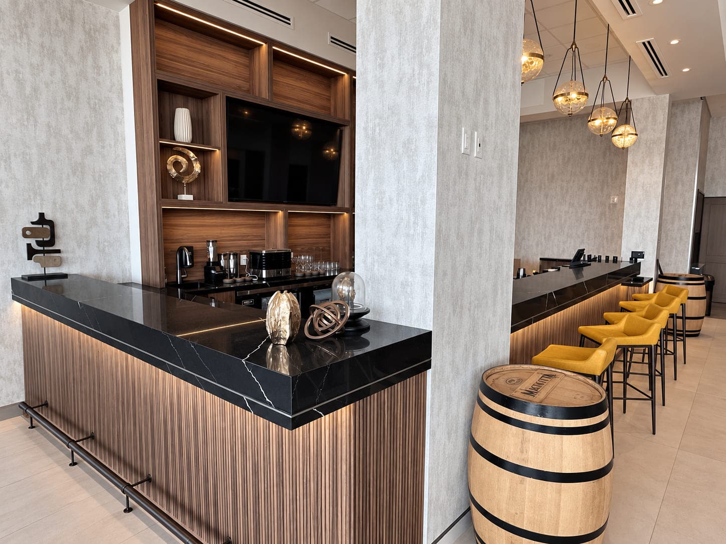 White kitchen with a veined, marble-look waterfall island